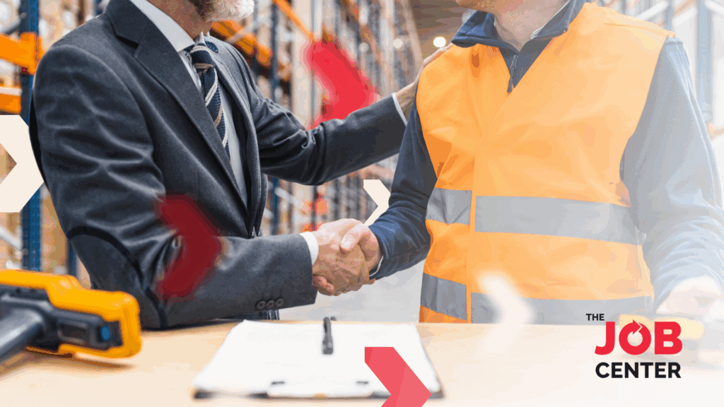 Logistics worker shakes hands with a manager after securing a stable job